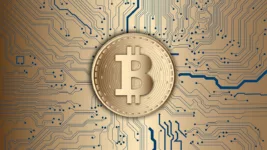 bitcoin on gold circuit background