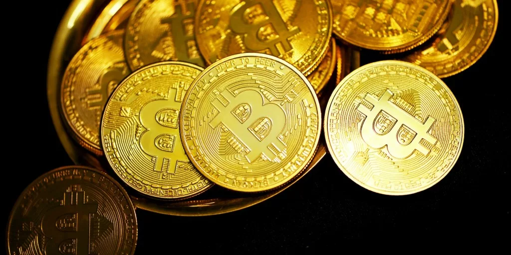bitcoin toppled over on a gold plate