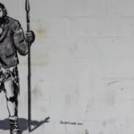 caveman graffiti with suit by crawford jolly