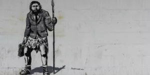 caveman graffiti with suit by crawford jolly