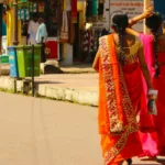 Indian women walking in the supermarket with traditional sarees
