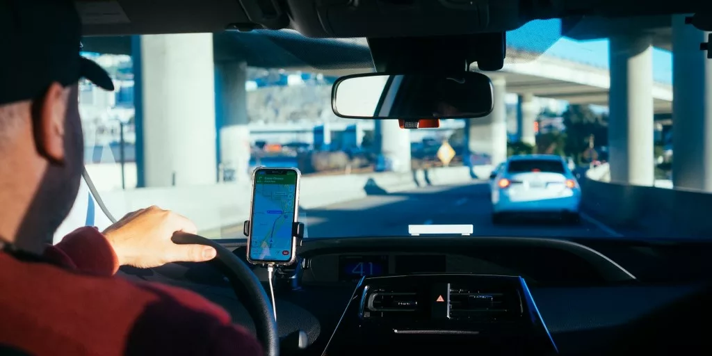 man driving drive driver smartphone dashboard