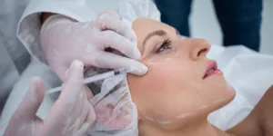 woman-with-marked-face-receiving-botox-injection